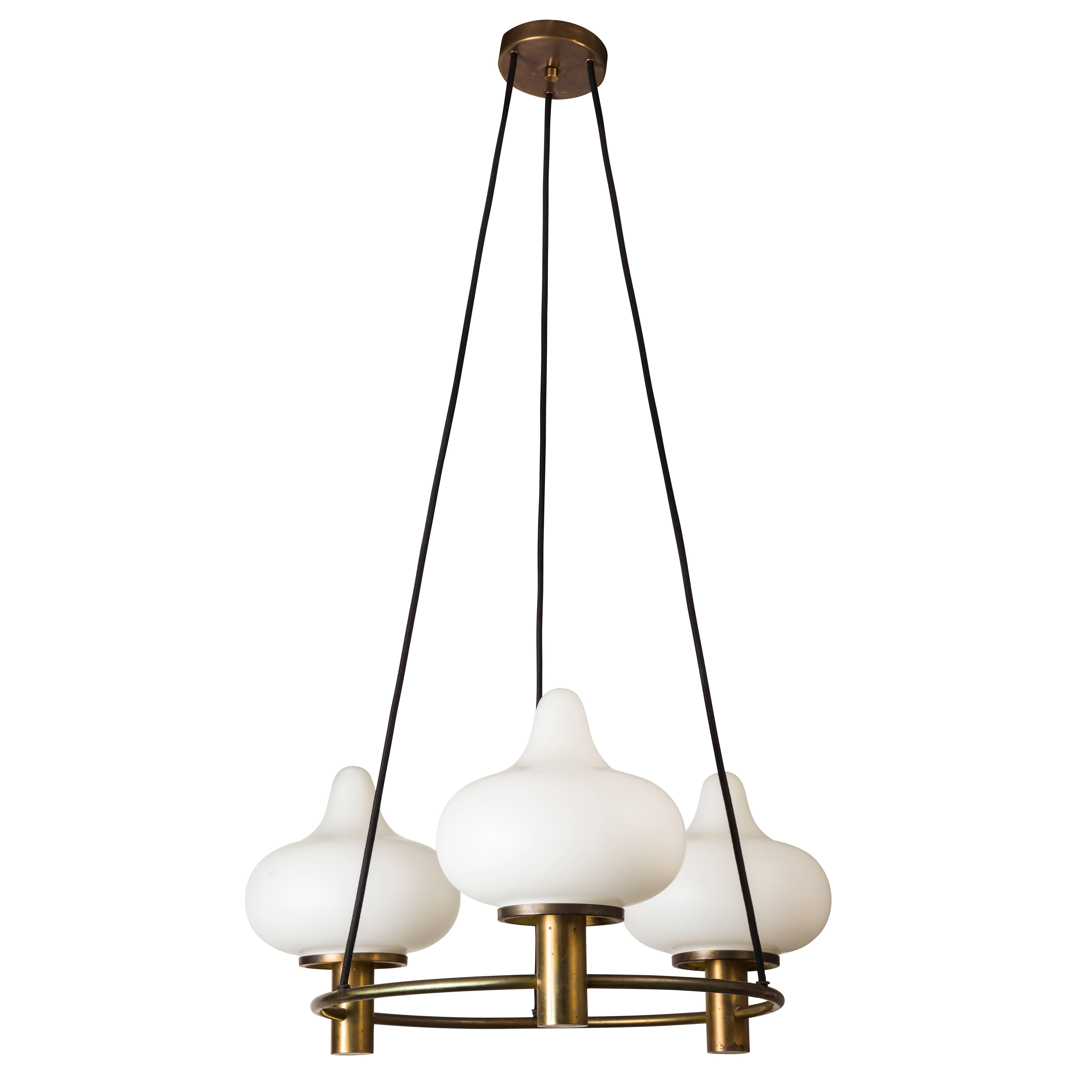 1950s Mogens Hammer & Henning Moldenhawer Chandelier for Louis Poulsen. Executed in patinated brass and matte opaline glass, Denmark. A very architectural and sculptural design that floats with lightness yet presents an attractive scale.