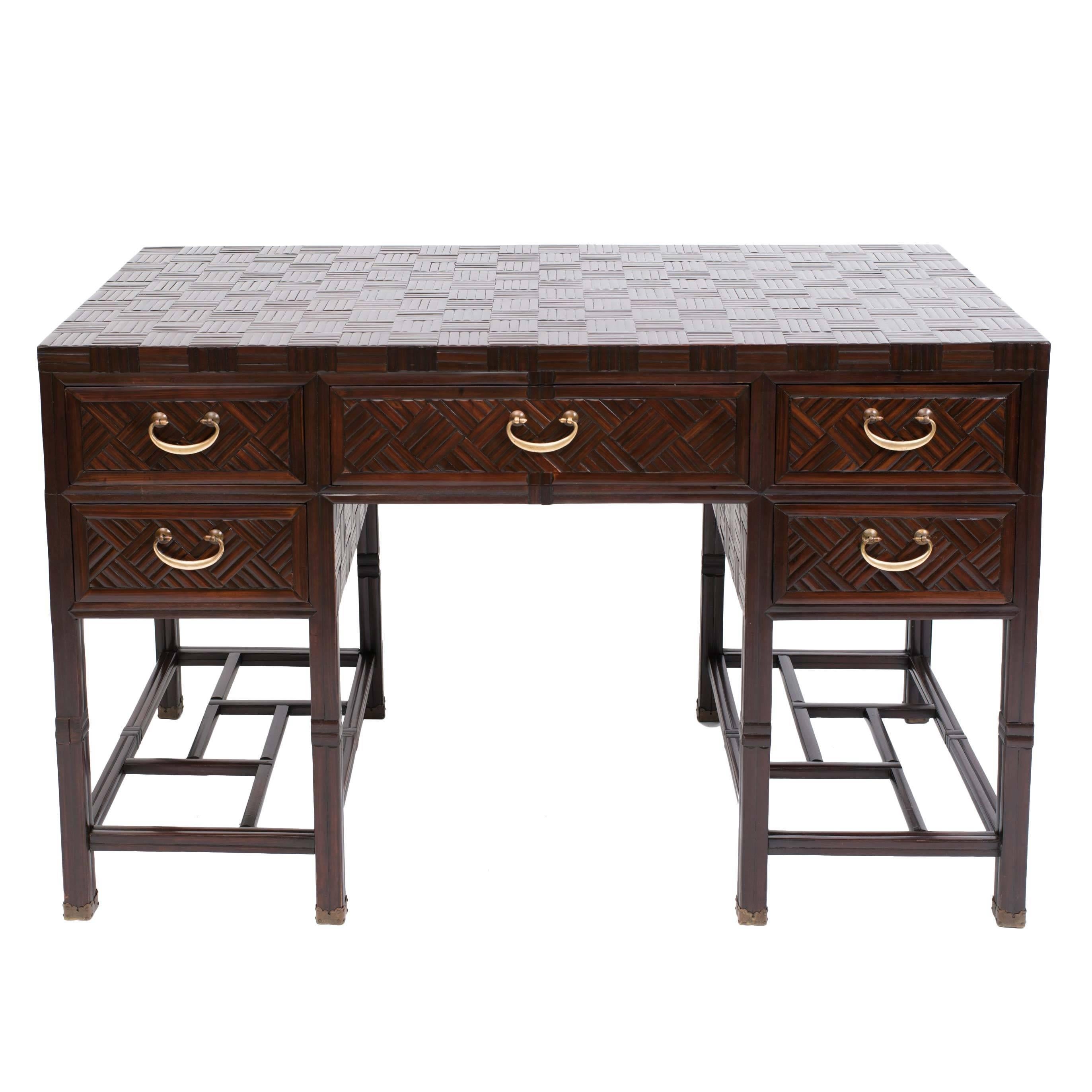 Gorgeous stained bamboo and hardwood campaign desk with five drawers. Finely detailed parquet work on top, sides and back of desk. Solid brass curved handles. Brass sabot detail to carved hardwood legs. 
Anglo Chinese, Hong Kong ,c. 1960's