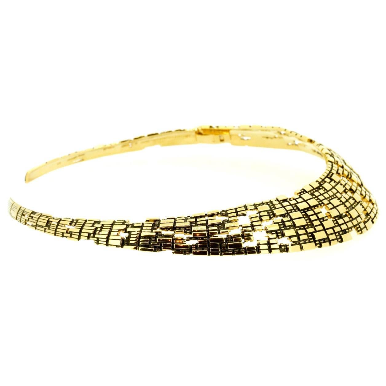 This fractal cubic collar by John Brevard is inspired by the Bitcoin blockchain and designed using a parametric modeling tool. This elaborate 18k yellow gold collar is made for the 21st century technology-forward woman. Also available with 40