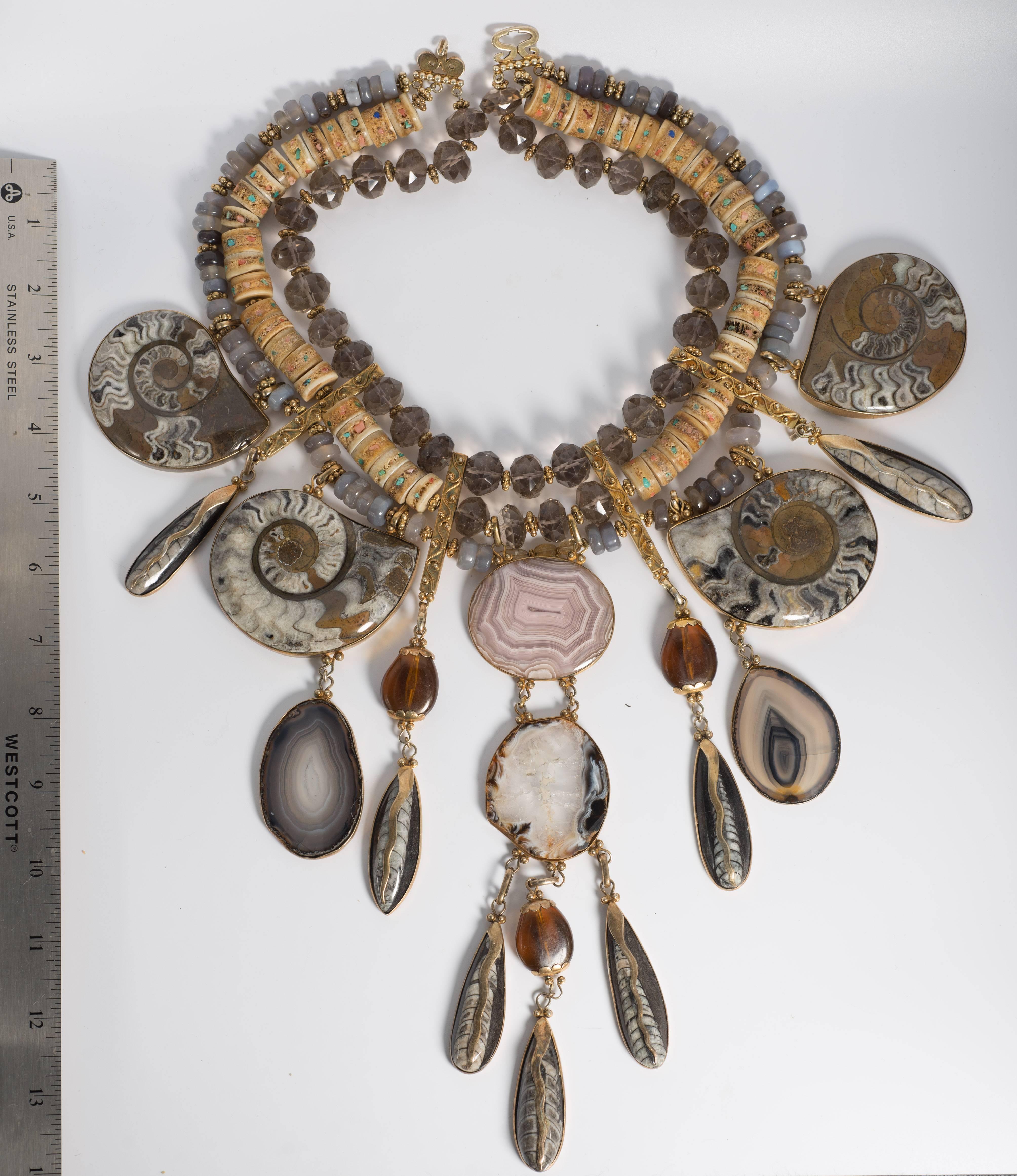 Tony Duquette Extraordinary Fossil Agate Citrine Necklace.

A Tony Duquette one of a kind masterpiece collar set with fossil agates of matching shades, amber, fossil pendants and strung with faceted smoky citrines, agate rondels and flecked stone