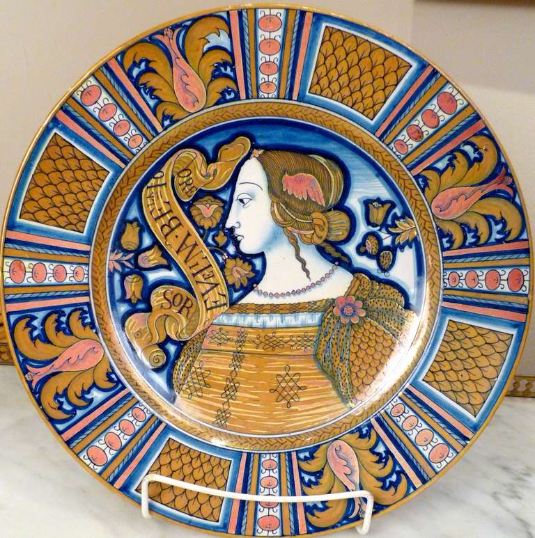 A late 19th century Italian Cantagalli Maiolica charger representing the profile of a young woman (La Bella). Marked on the reverse with the rooster mark of Cantagalli
