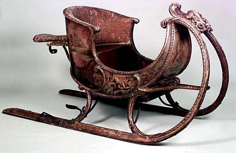Late eighteenth or early nineteenth century carved two person sleigh painted with traditional landscapes and scenes of courtly love.