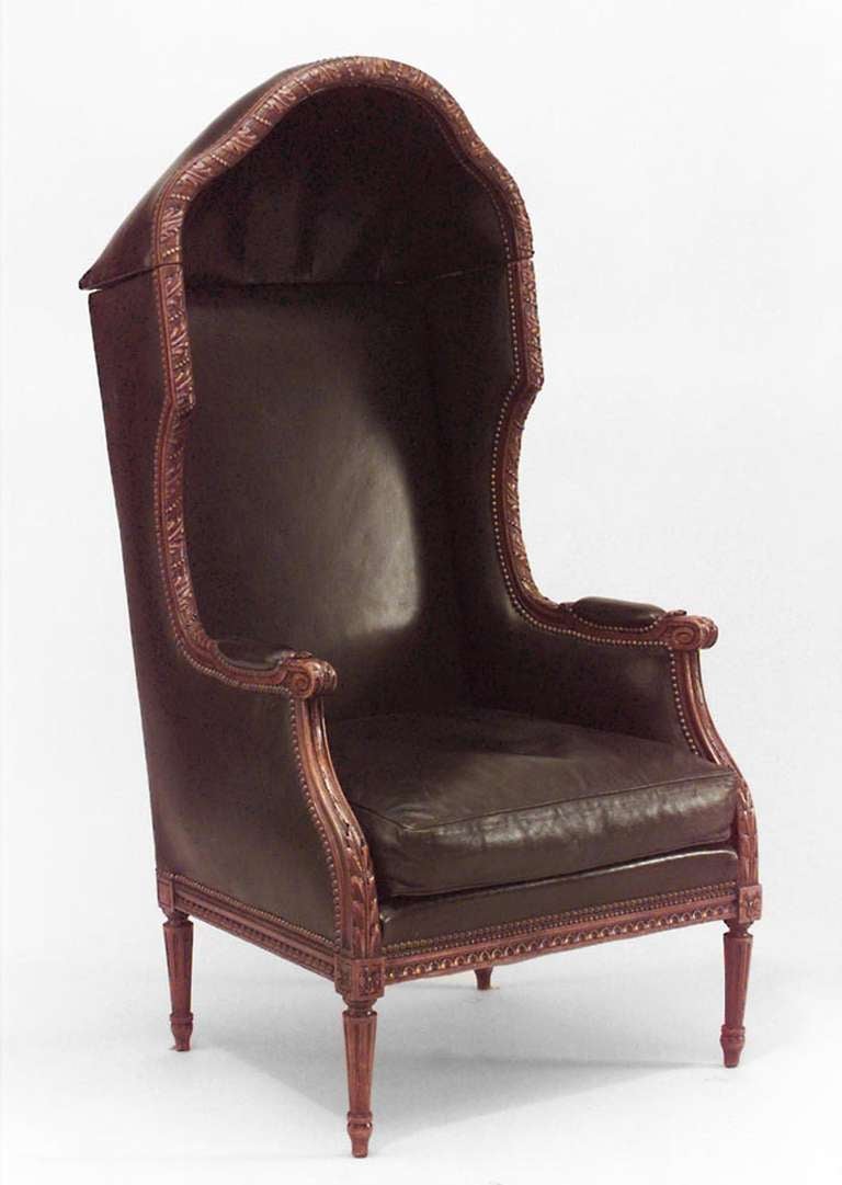 French Louis XVI style (19th Cent) walnut hooded draft chair with brown leather upholstery.
 