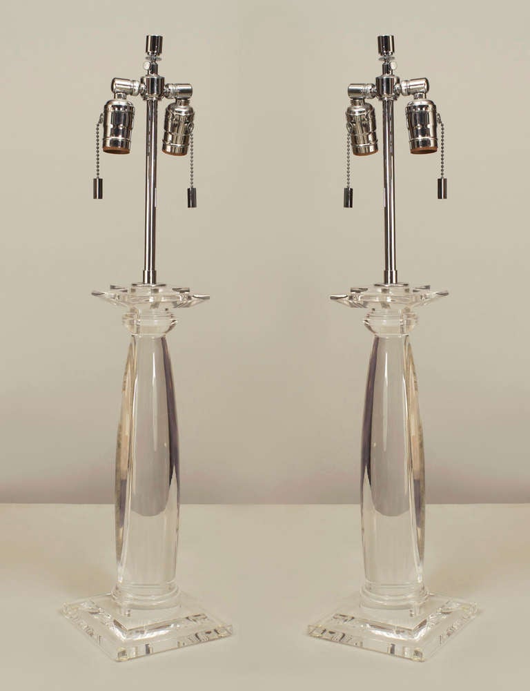 Pair of American 1960s Lucite table lamps shaped round column in between a square base and top with a chrome post and 2 light cluster (attributed to KARL SPRINGER) (PRICES AS Pair).
