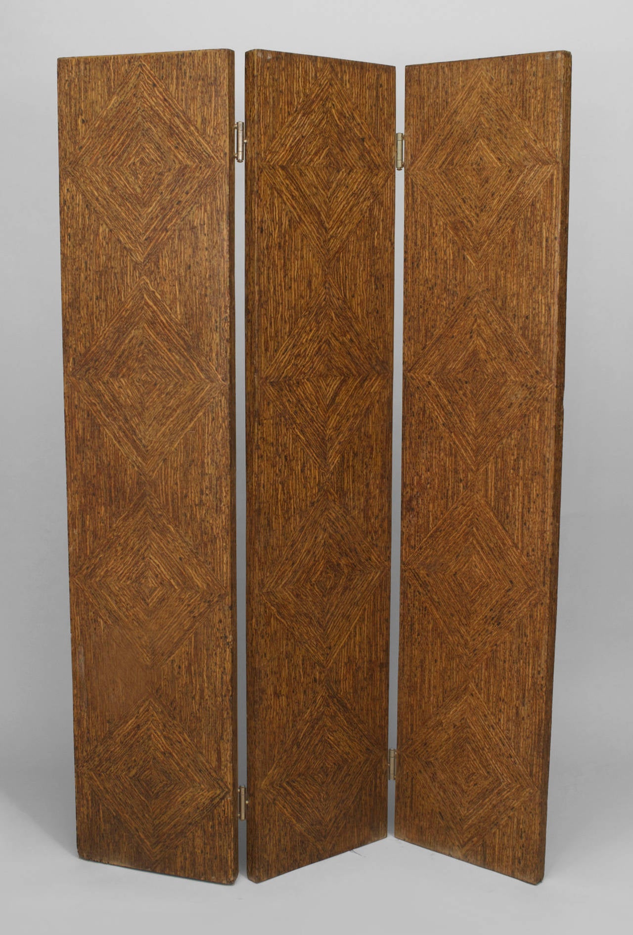 Pair of American Art Moderne (1940s) rust painted faux woven rush 3 fold screens with diamond design (priced as a Pair)