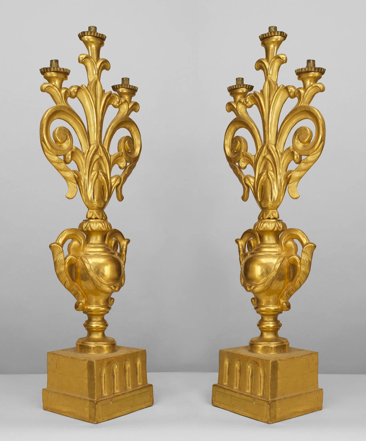 Pair of Italian Rococo style (3rd qtr 19th Cent) urn-shaped three scroll and filigree arm candelabra resting on a square base