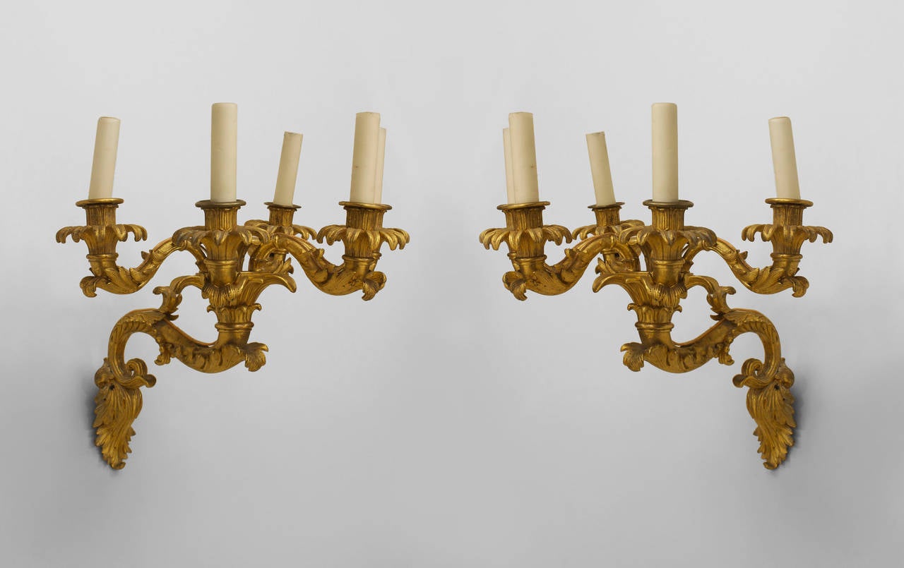 Pair of French Charles X (circa 1835) gilt bronze wall sconces with 5 scroll arms emanating from a center light. (PRICED AS Pair)
