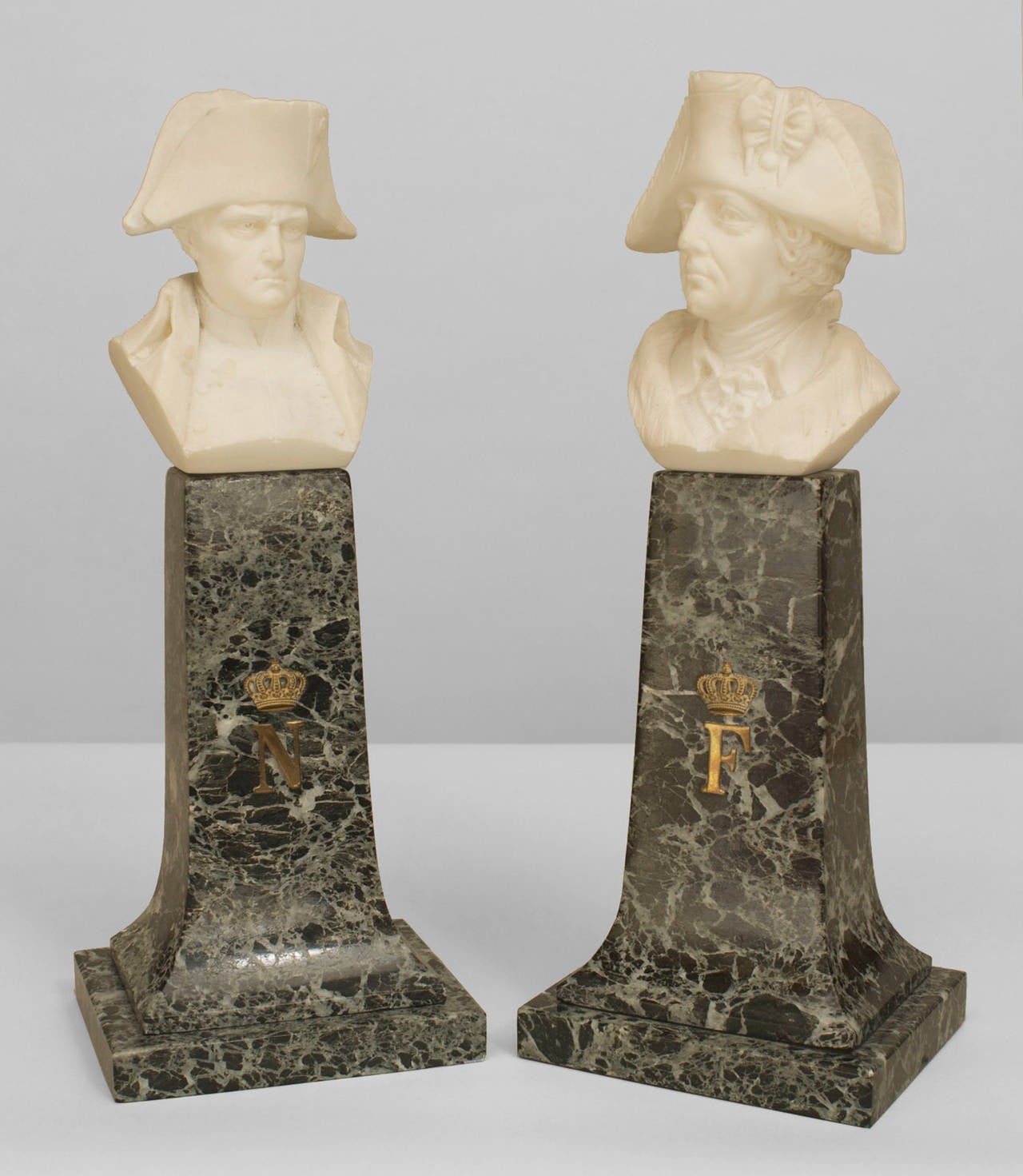 Pair of Continental German (19th/20th Cent) alabaster busts of Fredrick the Great and Napoleon raised on green marble column bases (by Fritz Kochendorfer and P. Braun) (as is-small chips to hat)
