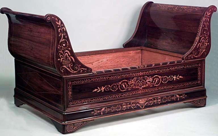 French Charles X rosewood and satinwood inlaid sleigh design daybed.
