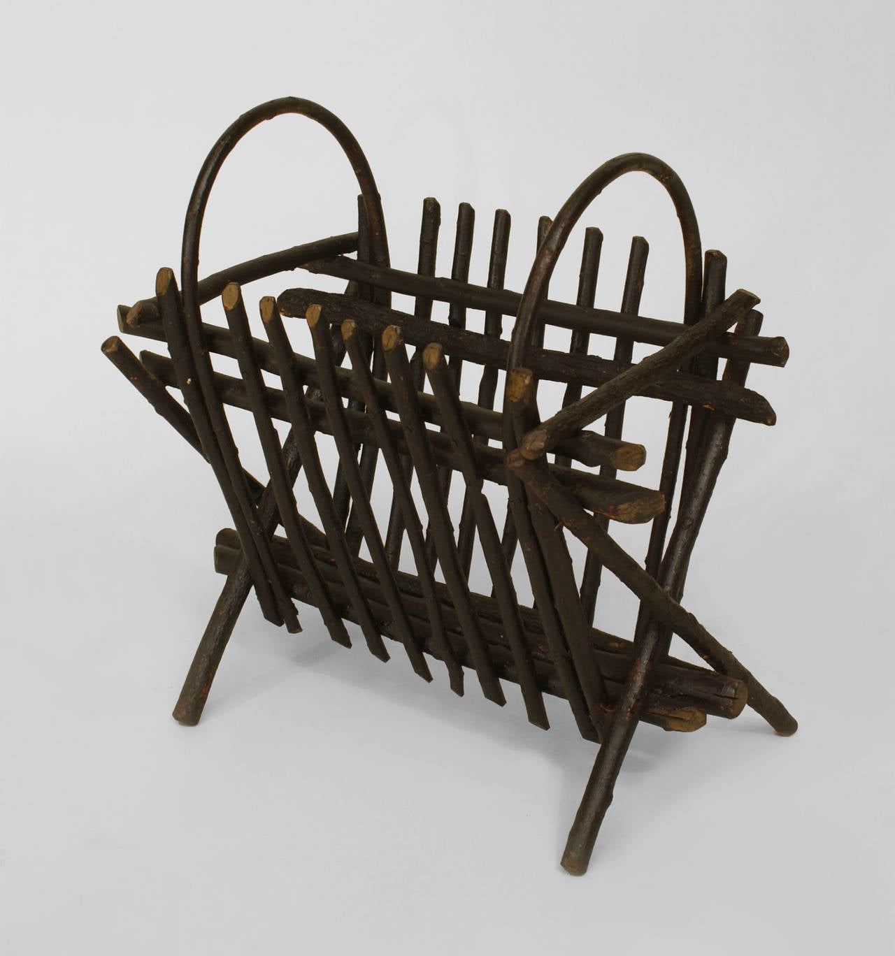 Rustic Adirondack (20th Cent) willow twig design canterbury/magazine rack
with slat sides and hoops on the ends.