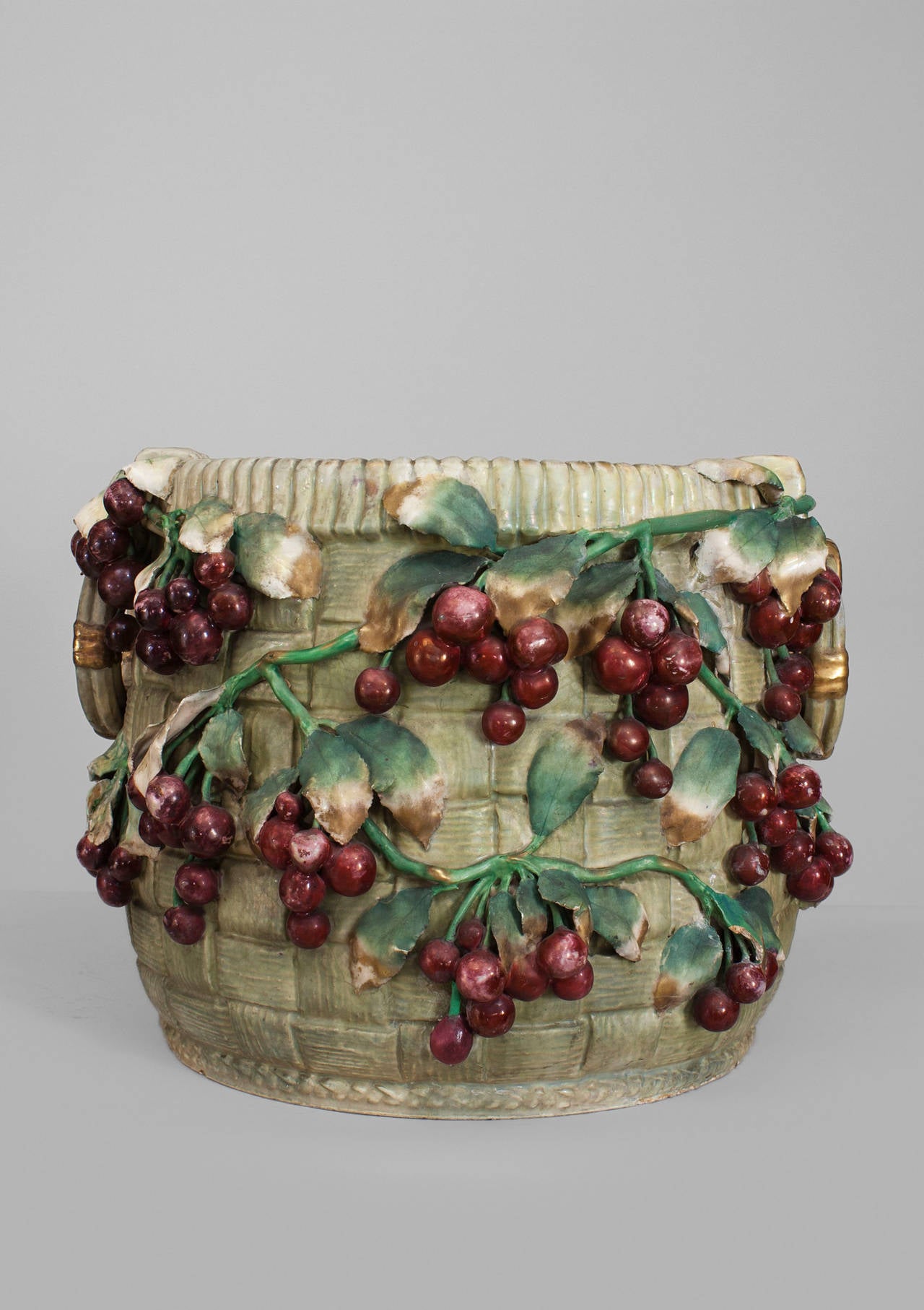 Continental (probably Austrian 19/20th Cent) large Amphora porcelain
jardiniere with side handles and a relief design of leaves & large cherries (signed and numbered).