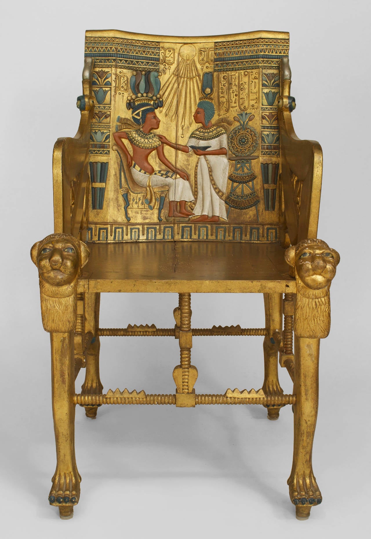 Egyptian Revival gilt armchair or throne with carved motifs and polychromed
relief with classical figures and hieroglyphics (possibly English, 1890s)