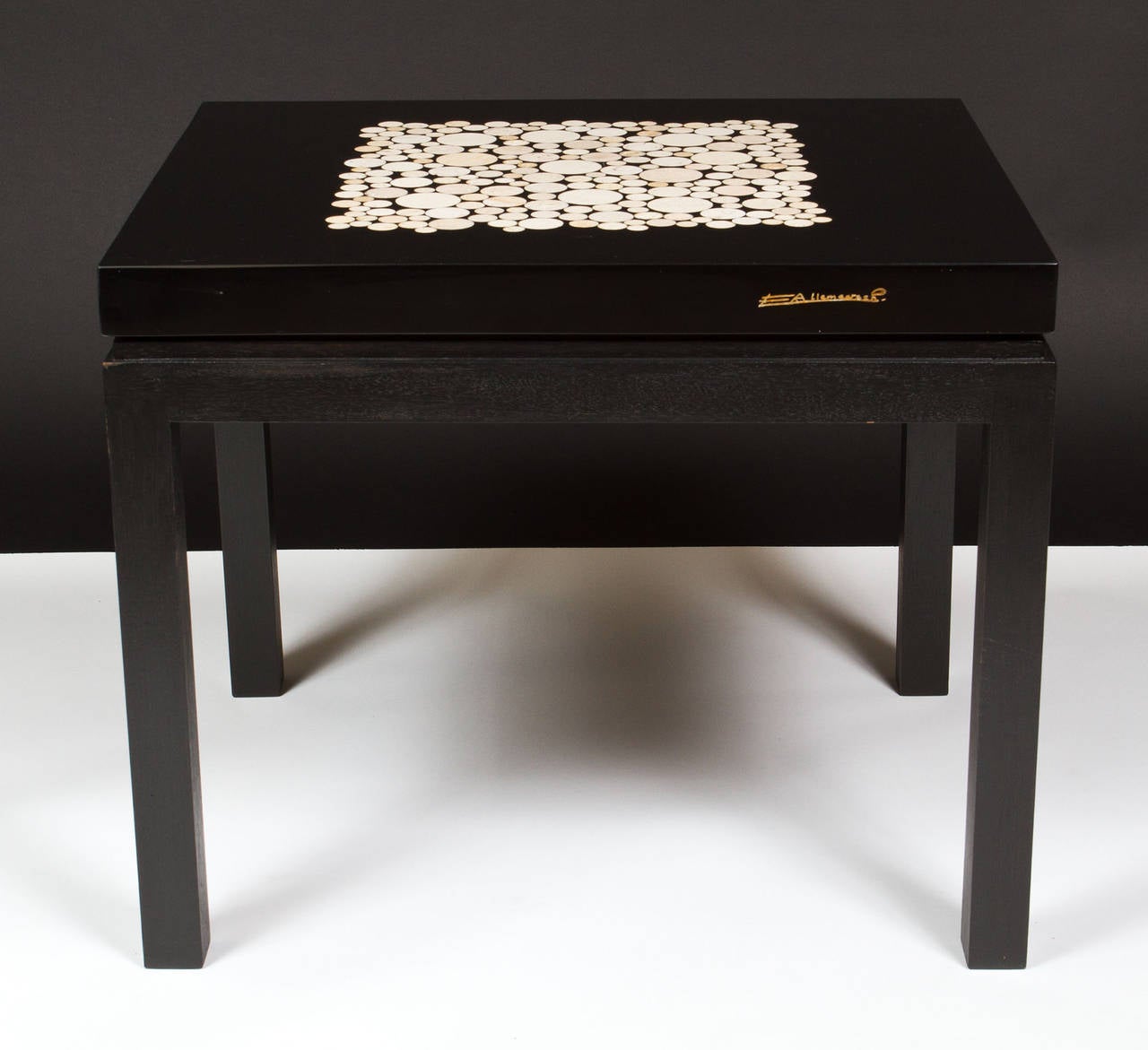 Pair of 1980s Belgian square ebonized wood low coffee or end tables with circular travertine inset pieces in a resin top; signed E(tienne) Allameersch.