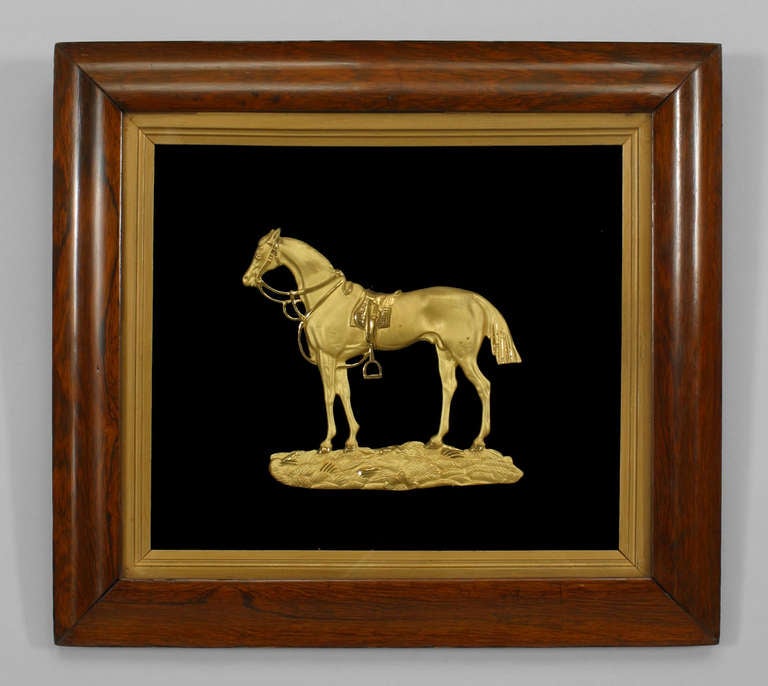 Pair of nineteenth century English rosewood framed wall plaques each depicting one gilt bronze horse figures against a simple black background.