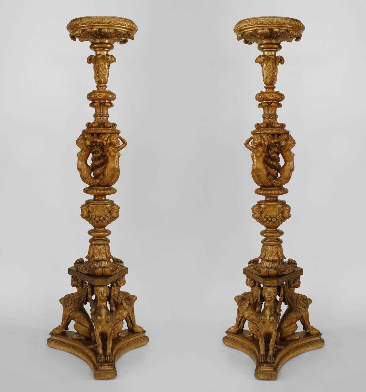 Pair of French Louis XVI style (19th Cent) gilt pedestals with 3 carved mermaid and griffins at base.
