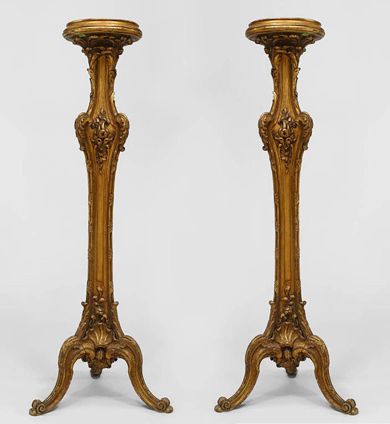Pair of French Louis XV style (19th Cent) gilt pedestals with 3 legs at base.
