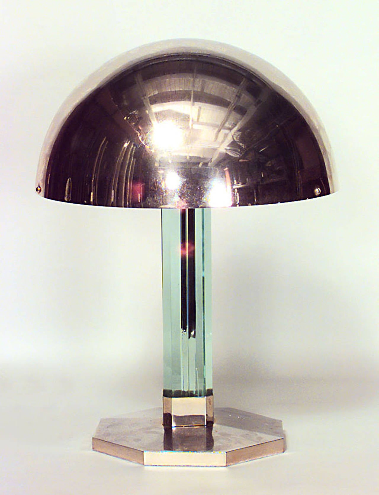 French Art Deco brass and glass column table lamp on octagonal base with
dome shade.