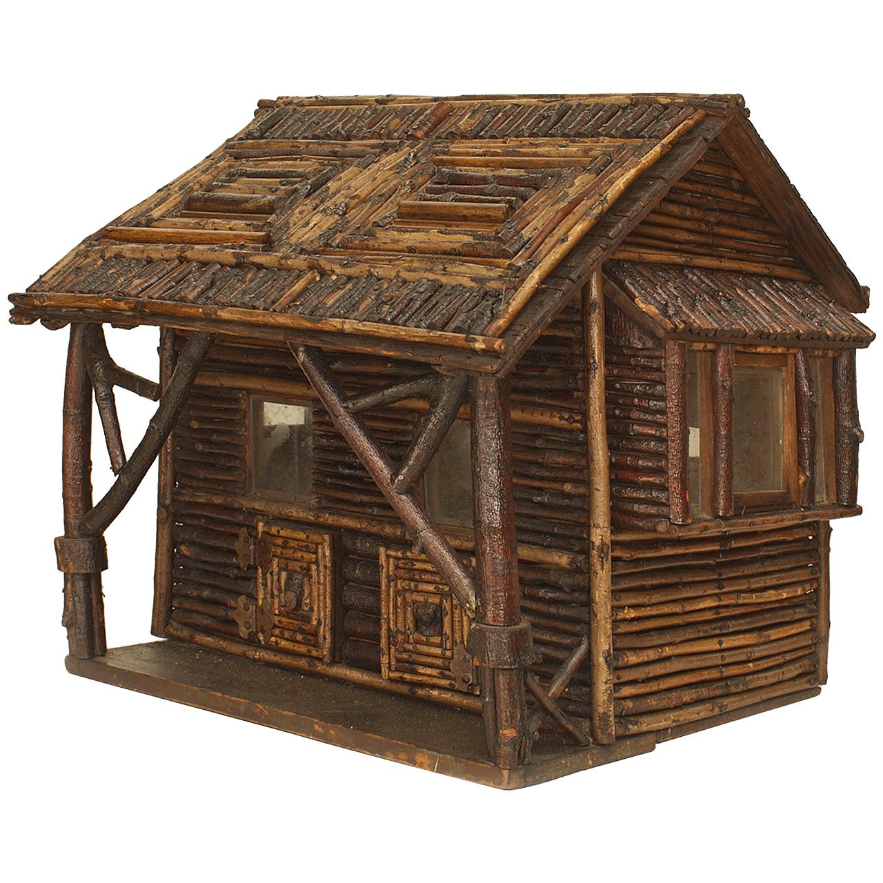 Early 20th century American rustic or Adirondack style model of a log cabin with glass windows and a porch with two doors.