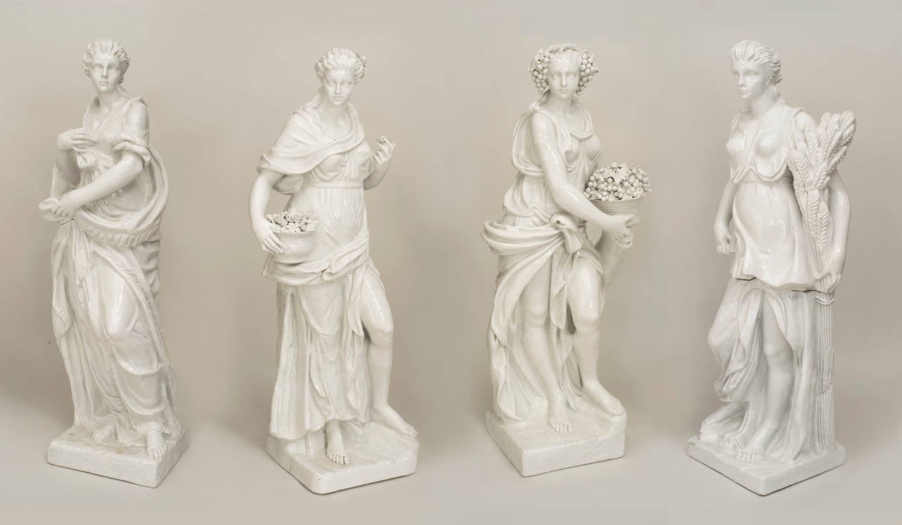 Set of 4 Italian (circa 1850) Neo-classic style large white glazed ceramic (each 2 section) figures personifying the Four Seasons.
