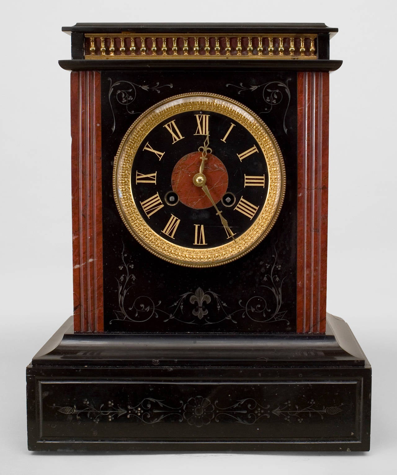 French Victorian black marble mantel clock with marble rosso antico column sides and gilded etched roman numerals. (Not working)
