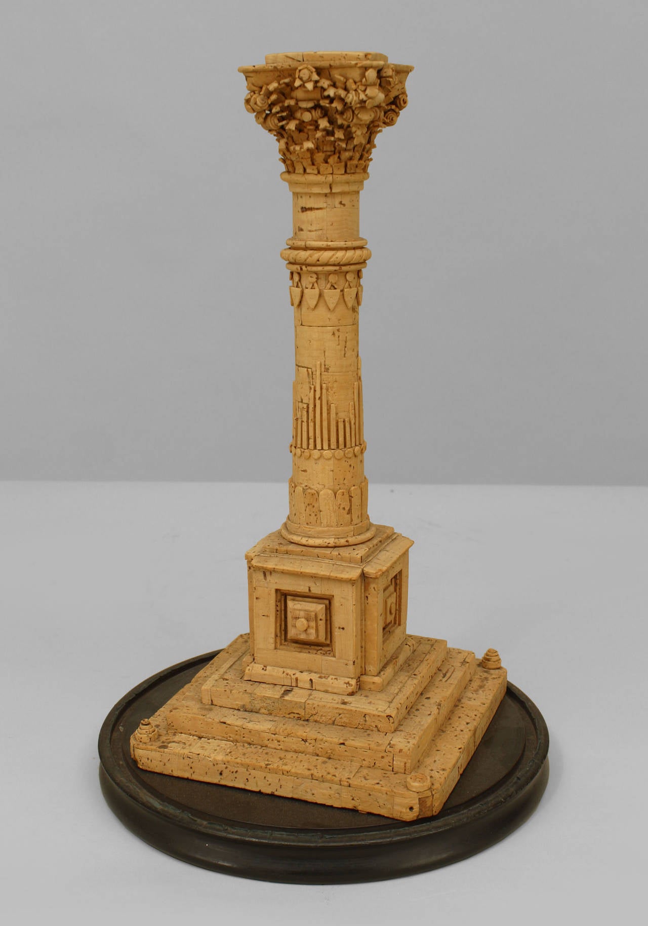 19th century Italian neoclassical cork carved model of a classical column with a Corinthian capital and resting on a stepped square base.