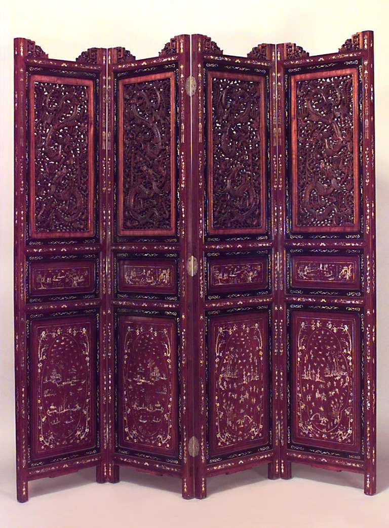 Nineteenth century Chinese screen comprised of four mahogany panels finely decorated with traditional motifs. The upper portion of each panel consists of fine filigree dragon designs framed by solid wood inlaid with bone and satinwood cartouches