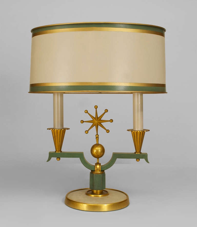 Signed by Genet et Michon and designed by Dominique, this 1940's French Art Deco table lamp is composed of gilt and green patinated bronze with a circular inset parchment base issuing forth two arms on either side of a decorative starburst finial.