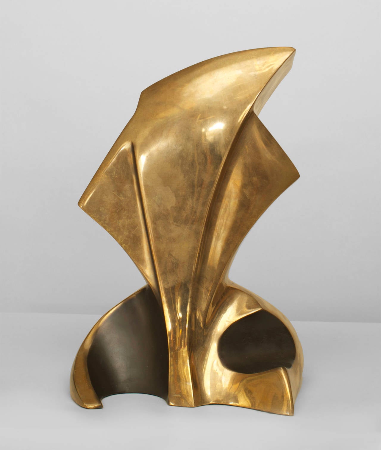 1980s American polished bronze free-form sculpture with four stylized convex black-painted scroll forms at base. The untitled piece is signed and dated by Bob Bennett, 1983.