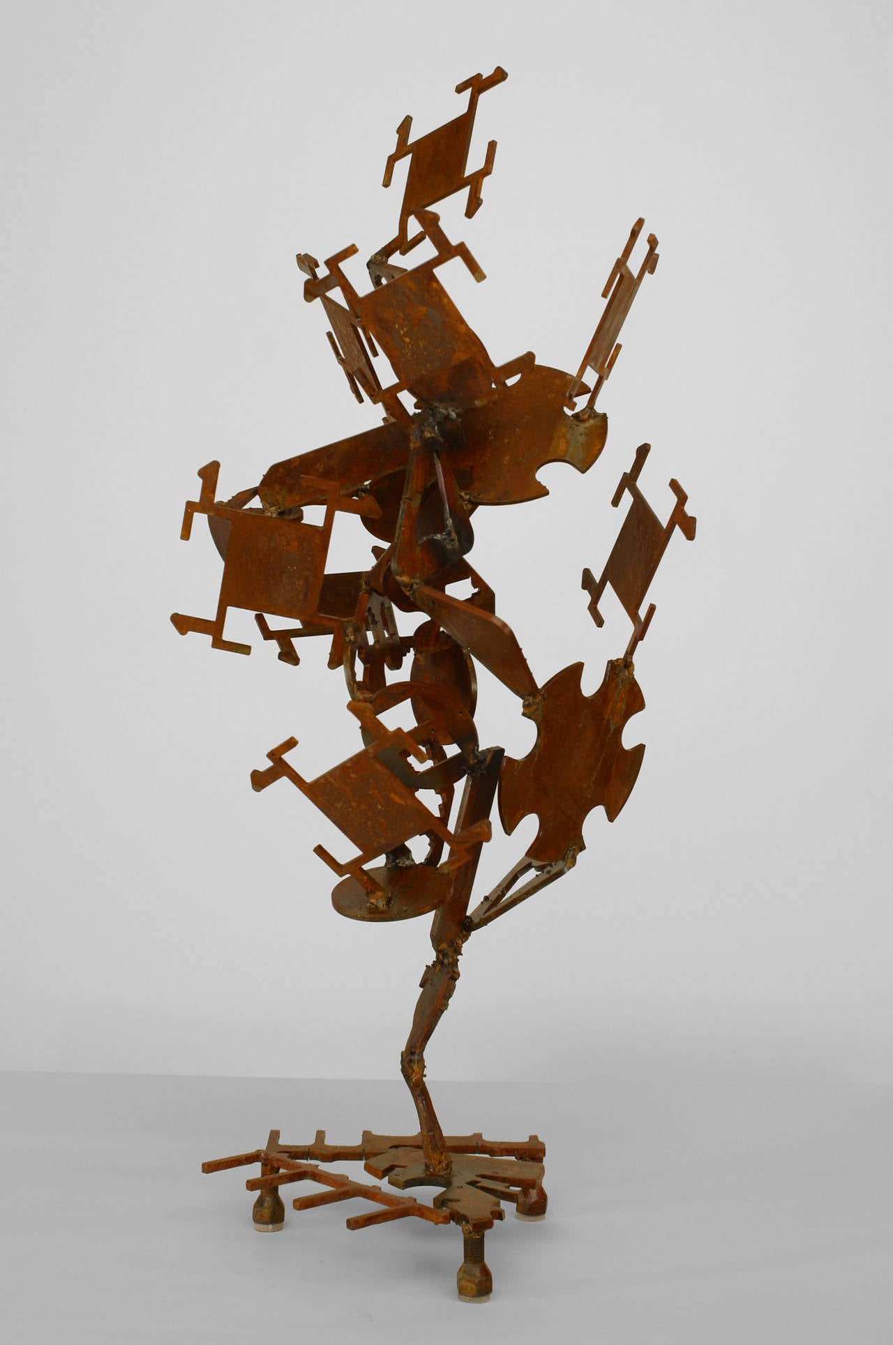 American Post-War Design Brutalist abstract sculpture composed of welded iron shapes with a rust patina.
