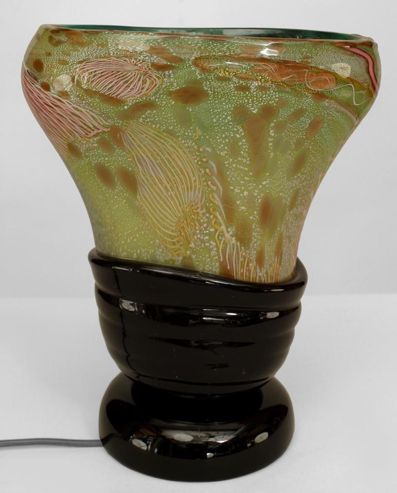 Italian 1960s Venetian Murano glass oval shaped table lamp of vase form with green, pink, and white free form design on a round applied black glass base. (att: NICHETTO)
