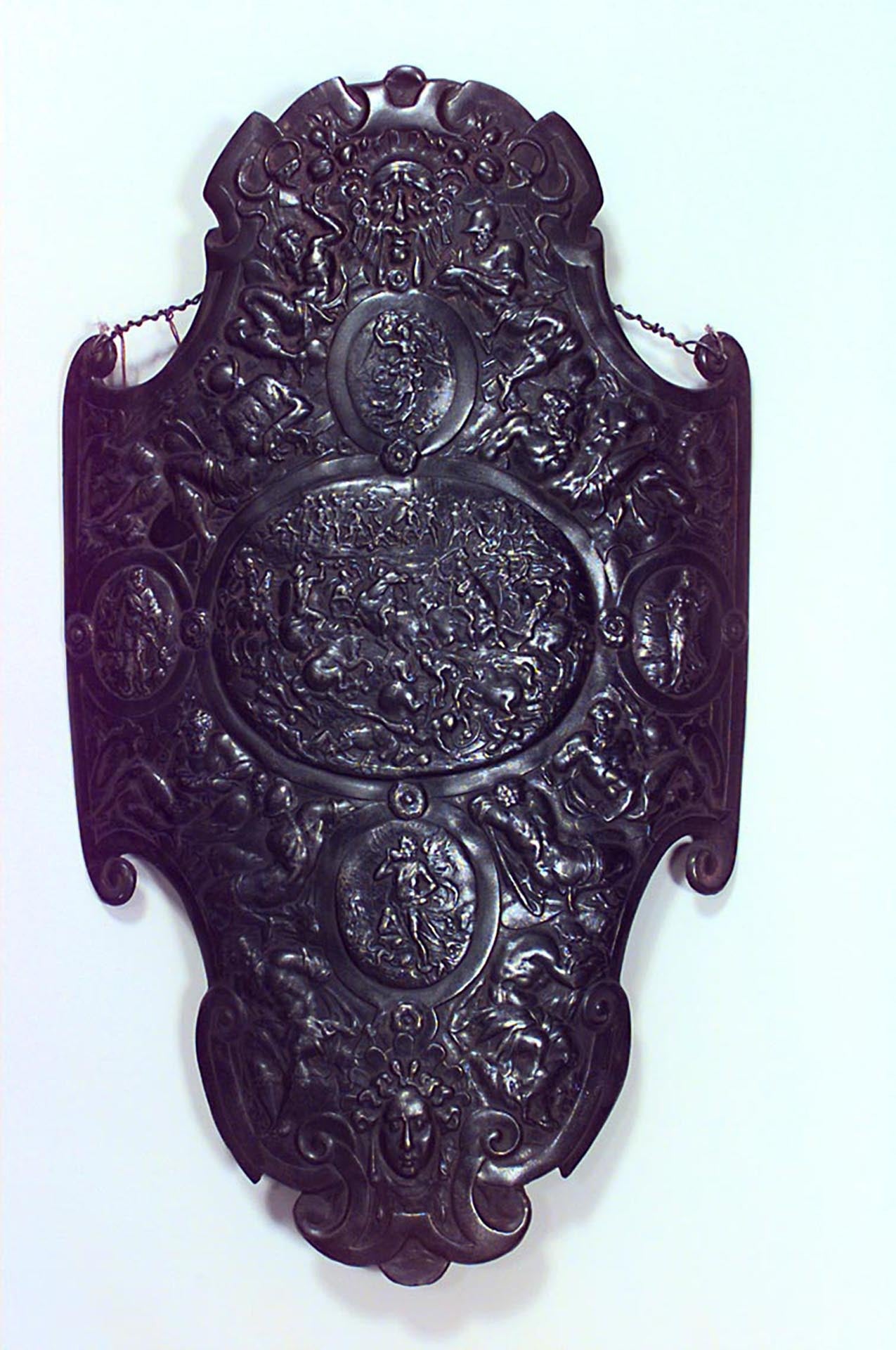 Italian Renaissance-style (20th Century) iron breast plate / wall plaque with figures and scenes in relief.
