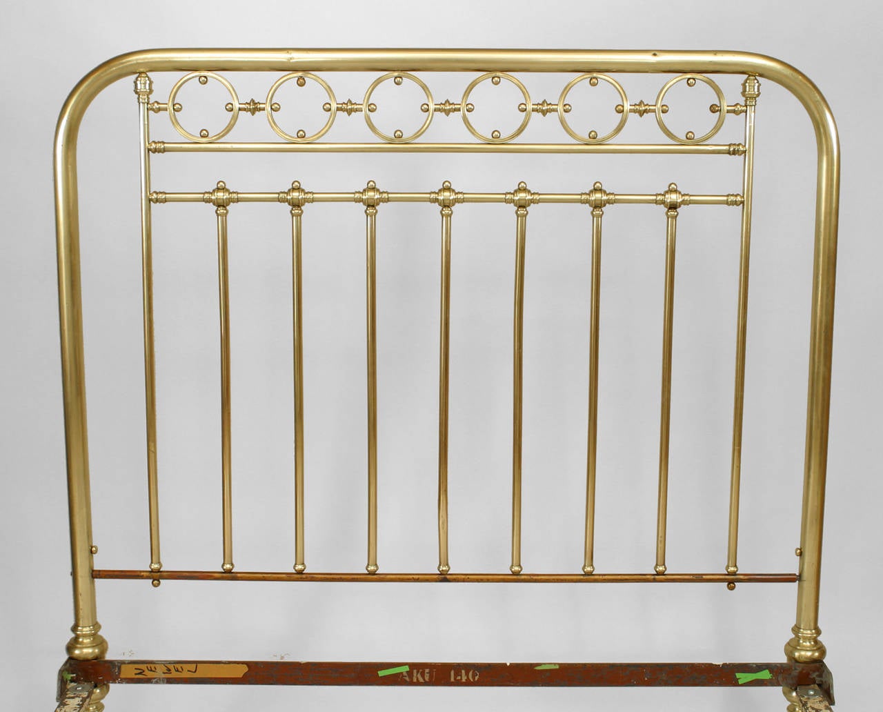 American Victorian brass full size bed with a spindle and circle design.