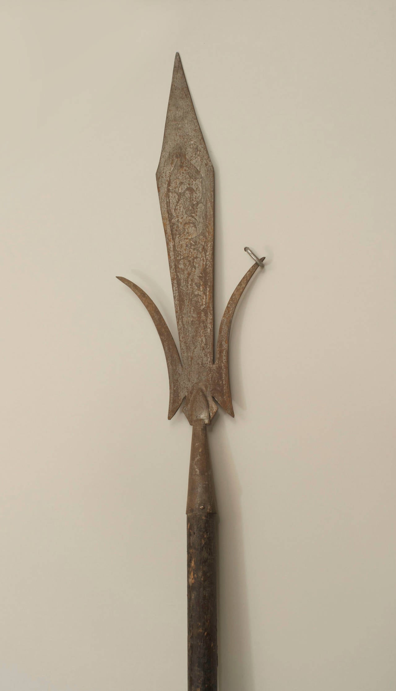 English Renaissance-style spear with simple wooden shaft and etched 24¬Ω-inch three segment iron blade.
