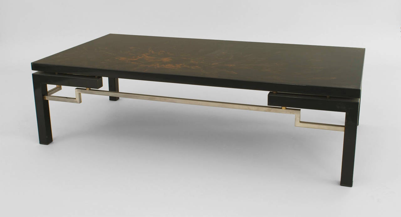 Asian art moderne lacquered rectangular coffee table with a gold.
Abstract floral design top and an open steel design above square legs. With a signature of possibly 