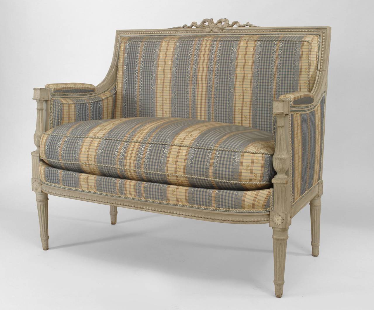 Pair of French Louis XVI style (1st half 19th Cent) grey painted loveseats (Marquise) with carved frame and bow-knot on back with striped upholstery and cushion.
