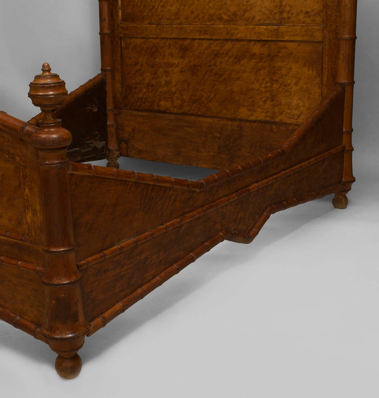 Late 19th century American Faux-Bamboo bird's eye maple queen-size bed with pediment top, finial sides, and faux bamboo carved trim (headboard, footboard, rails).