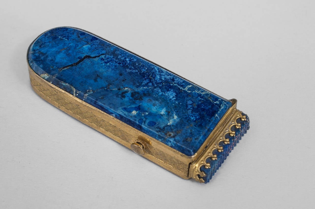 19th century French blue lapis veneered match holder with mechanical top
striker and trimmed in gilt metal