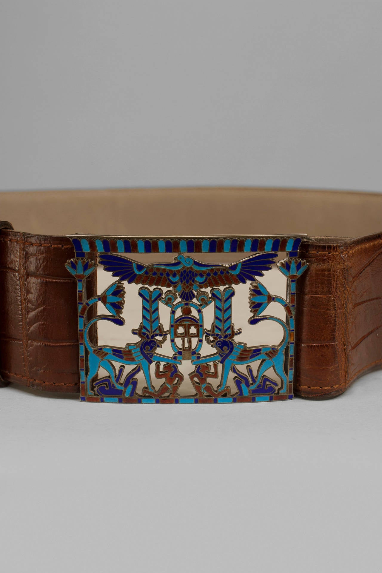 French Art Deco crocodile belt with an Egyptian themed cloisonn√© buckle.
