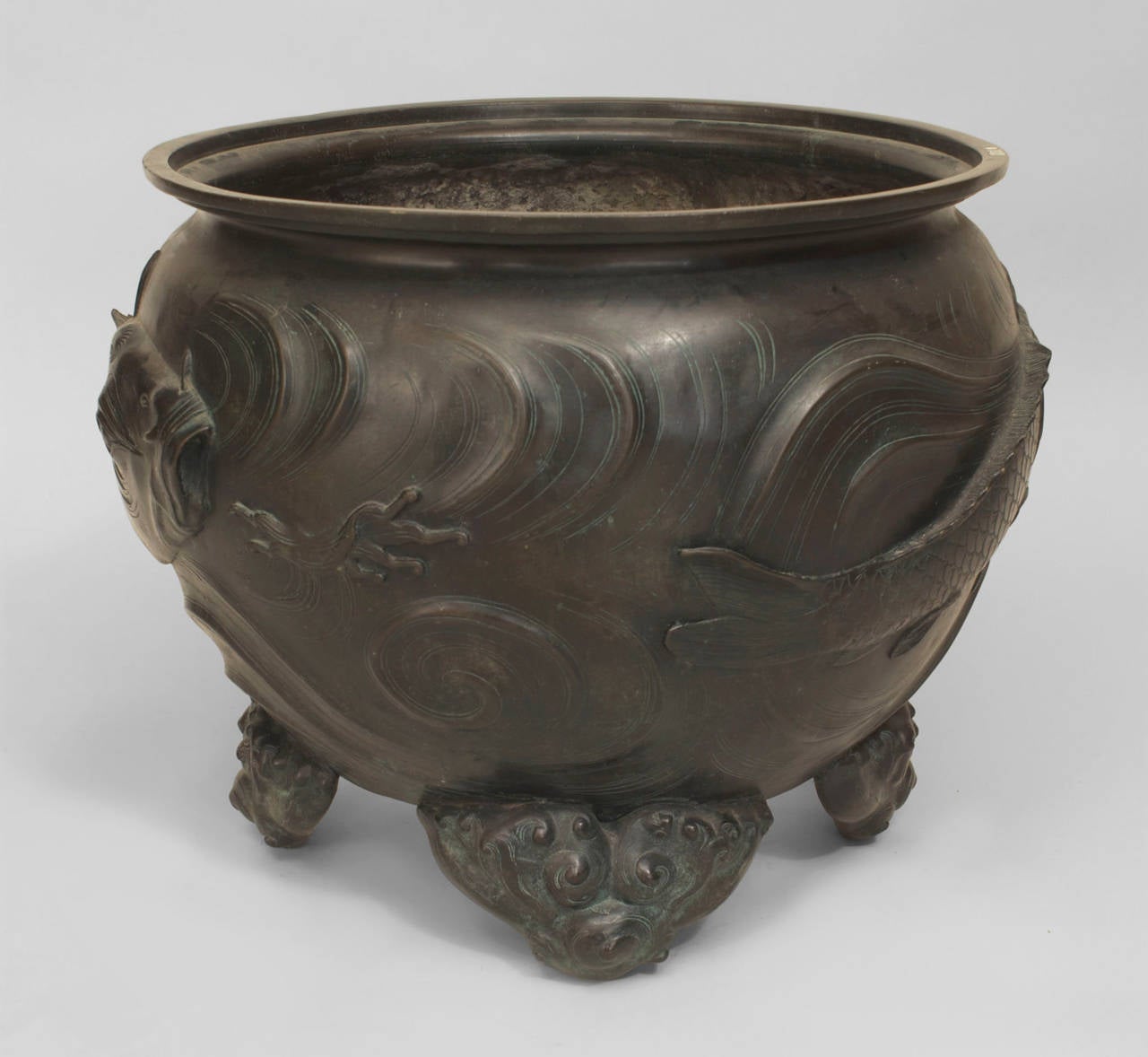 Oriental Japanese (19th Century) bronze large jardiniere with a green patina and carp in relief and raise on 4 cloud form feet (Koyoto School; Meiji Period)
