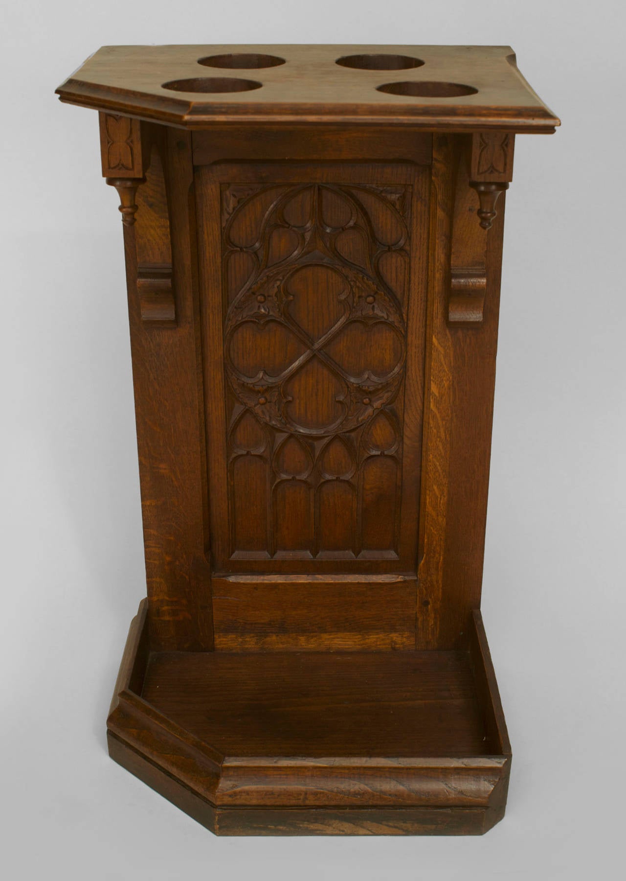 English Gothic-style (19/20th Century) oak cane/umbrella corner stand with a tracery carved panel.
