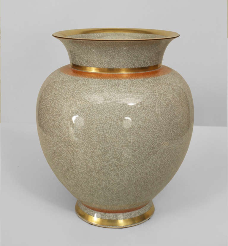 Signed Royal Copenhagen, this 1950's Danish vase is composed of grey crackled porcelain with gold and orange accents at the base and rim.

Similar to item # LU97791100050.