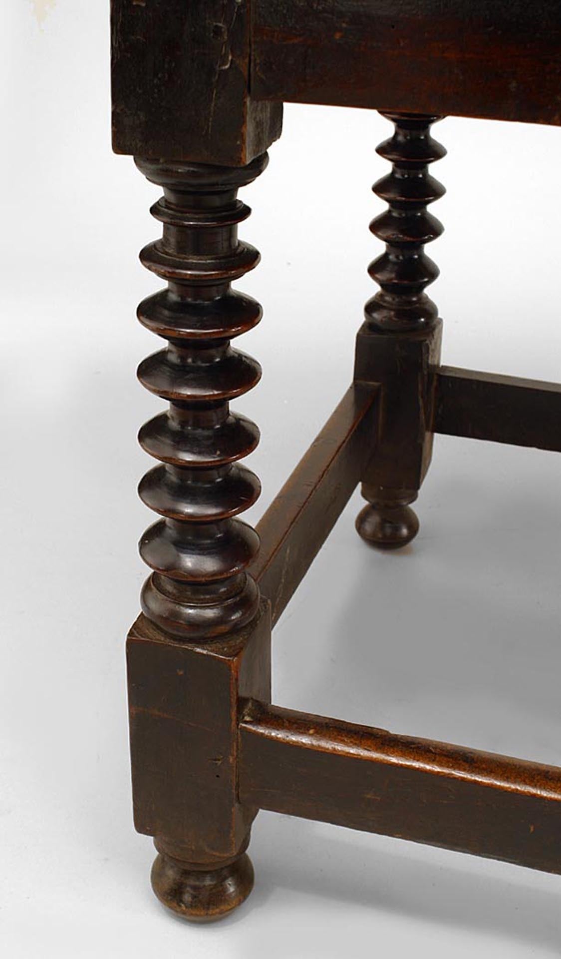 English Renaissance (17th Century) walnut table desk with spool legs and 2 drawers with stretcher.
