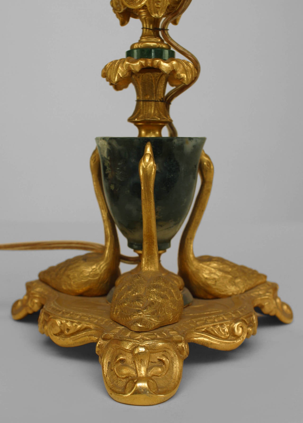 Pair of French Louis XV style (1940s) bronze dore and green agate table lamps with 3 swans at base (PRICED AS Pair).
