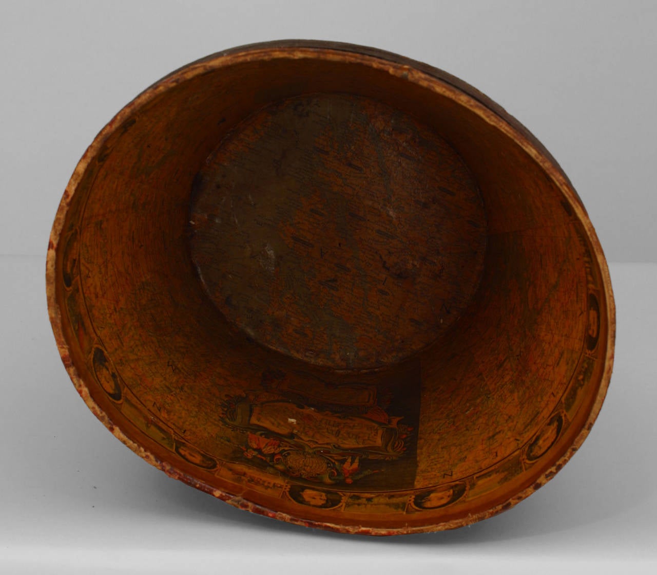 19th century American dark red leather top hat box with decoupage interior
showing a map of America and portraits of 18/19th century notables. Please note that the box is missing its lid.