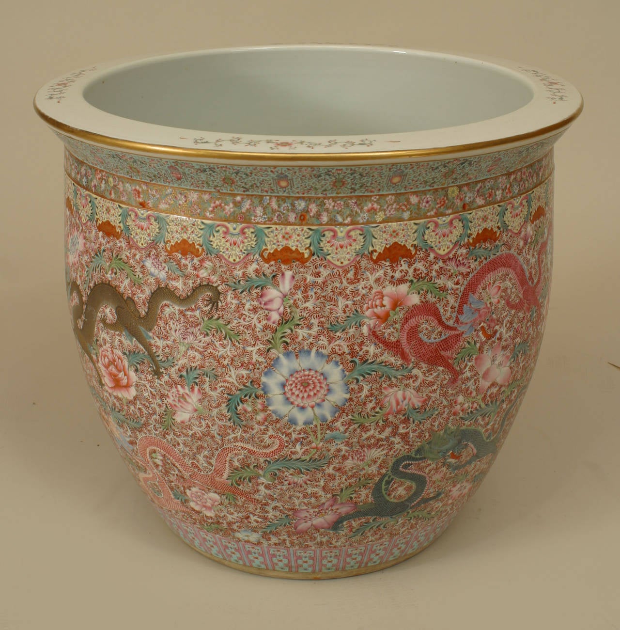 20th century Chinese Rose Medallion style jardiniere with a floral and gilt dragon design.