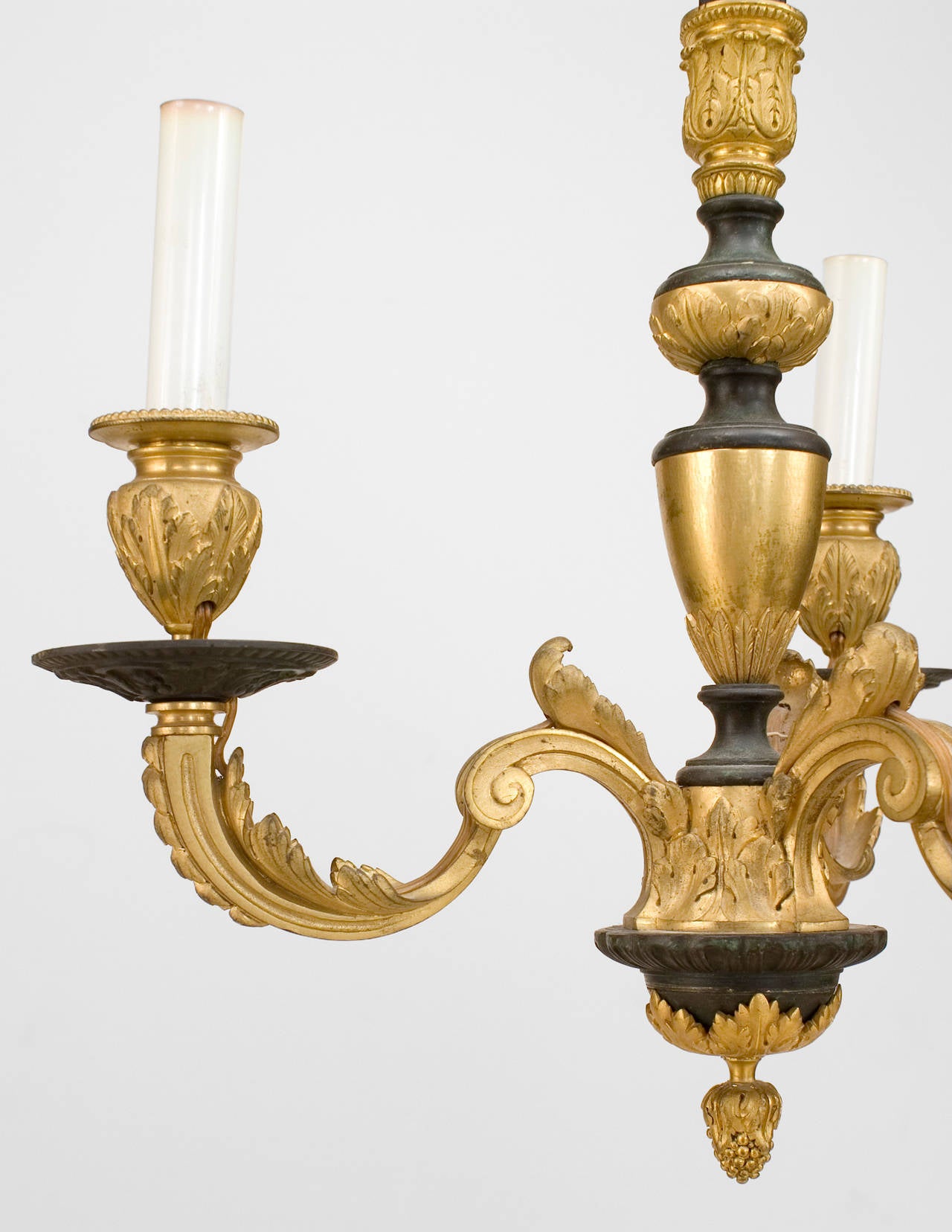 French Victorian-style (19/20th Century) bronze black and gilt chandelier with 3 scroll arms and a fluted center post with an acorn finial bottom.
