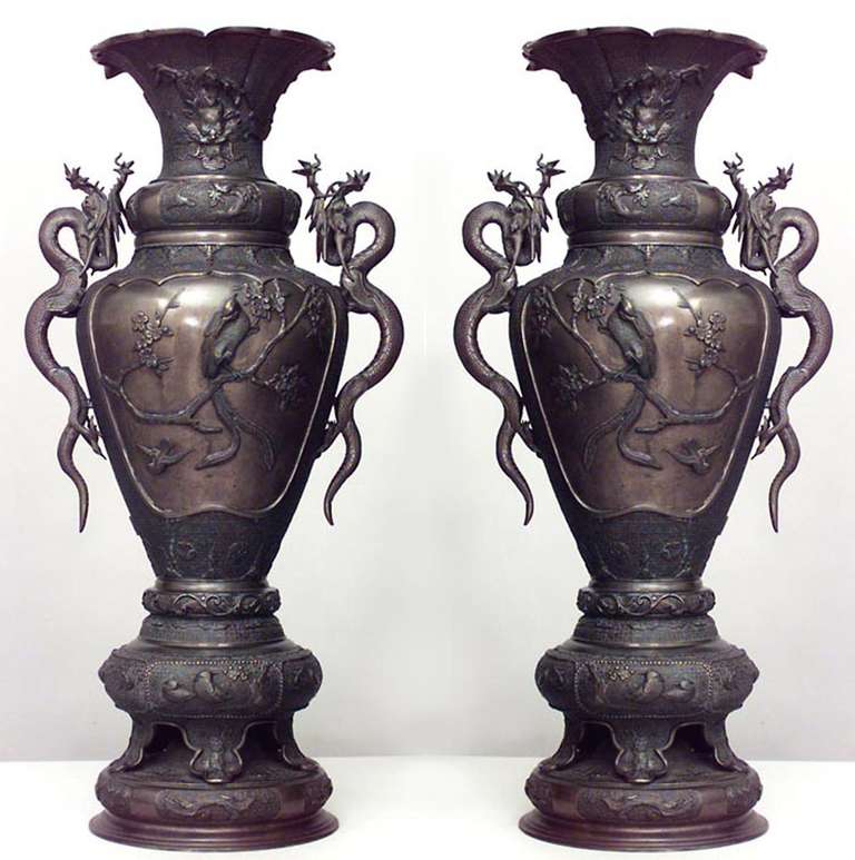Pair of Asian Japanese style (19th Cent) bronze palace urns with bird reliefs, flared tops and dragon handles (minor rePair to 1 handle) (PRICED AS Pair)

