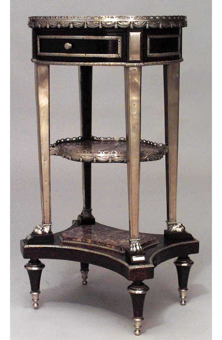 French Louis XVI-style (19th Century) mahogany three-tier table with and oval marble top with bronze trim, gallery, and shelves.
