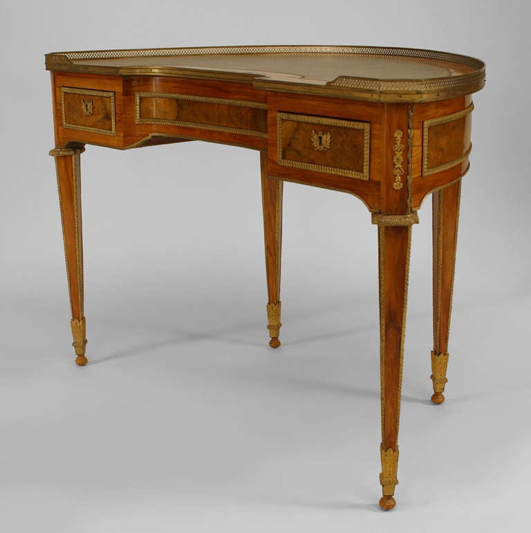 French Louis XVI style (18/19th Century) kingwood demilune shaped desk with bronze dore trim and gallery with leather top.
