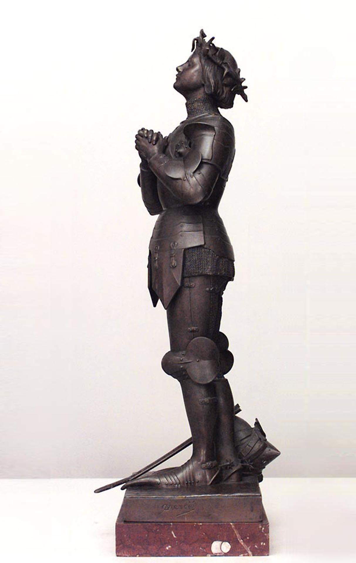 19th century French patinated metal figure of Joan of Arc standing on a rectangular rouge marble base, by Marius-Jean-Antonin Mercie b.1845-d.1916.
